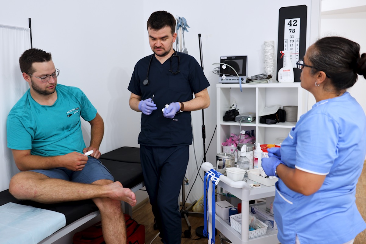 CissaMed medical team assessing a patient in the clinic treatment room in Novalja