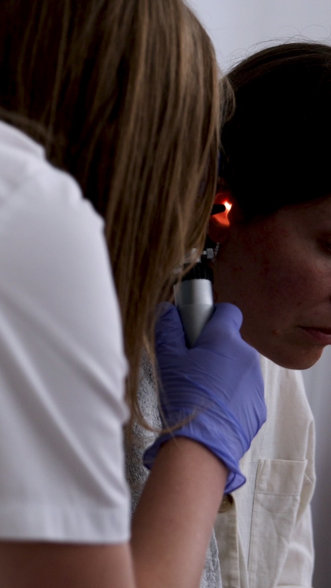 Doctor examining a patient’s ear at CissaMed in Novalja
